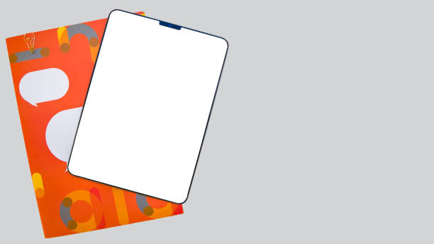 istock Tablet with blank screen on a gray background. Mockup. 1882027267