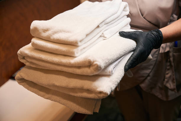 istock Hotel worker in uniform is changing bathroom supplies 1882030389