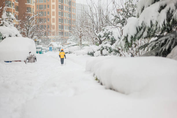 istock People walking on the snowy ground in heavy snow 1882057777