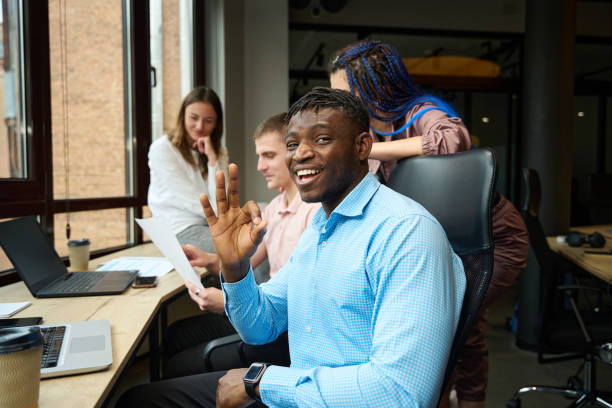 istock Extremely happy man showing ok gesture and smiling looking at camera 1882114357