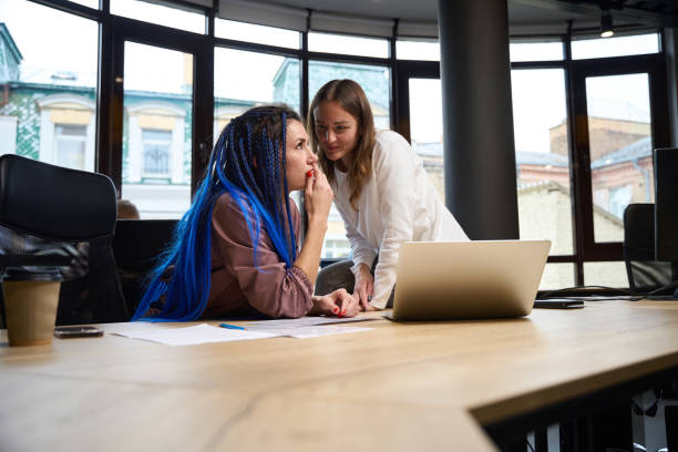 Woman manager talking to her boss, discussing private themes