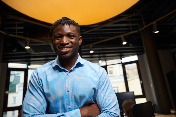 istock Man with stylish hairstyle sincerely laughing looking at camera 1882114380
