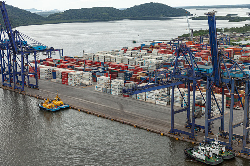 Paranagua, Brazil – May 08, 2013: aerial view of port with crane loading containers, ready to load ship for export