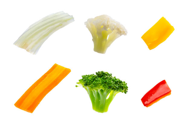fresh ingredients for Chinese yakisoba noodle dish composition, separated on a white background: cauliflower, red pepper, yellow pepper, broccoli, car