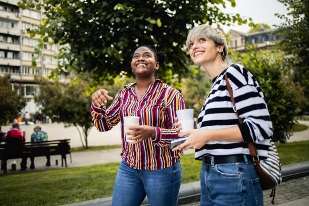 istock Two happy young women are having fun outside 1882193633
