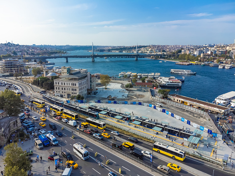 Istanbul, Turkey - September 1 2023: Drone view of Galata Bridge, city traffic on a bright sunny day in Istanbul. Beautiful lively Istanbul cityscape from a drone.