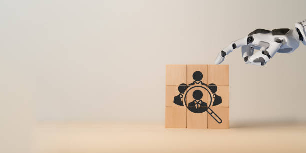 istock Using AI for recruiting concept. 3d rendering robot hand put ,pick or choose the one who got idea or special or right man for job than other in human resources management (hrm) or recruitment concept. 1882194784