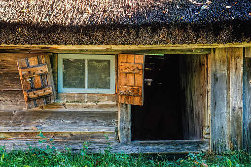 Old wooden croft with an open door