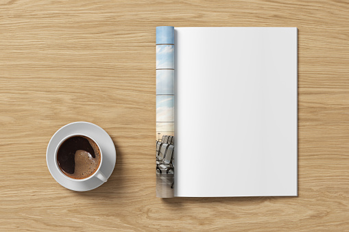 Magazine right-hand page mockup and cup of coffee on wooden desk. 3d illustration