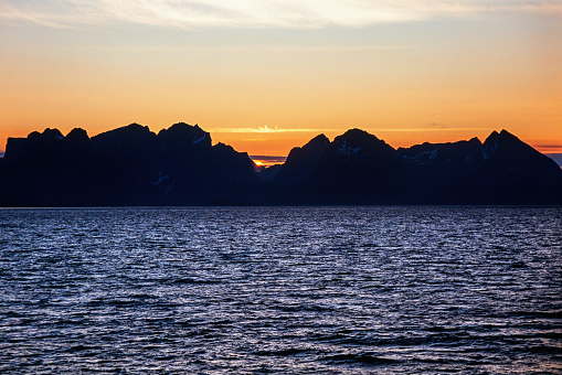 Beautiful sunset at the Lofoten Islands in Norway from the sea