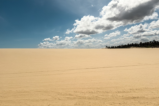 Namibia Langstrand Desert Sand Dunes. Beautiful giant Namib Desert Sand Dunes under blue summer sky. Drone point of view towards gigantic Langstrand Sand Dunes - Namib Desert Dunes between Swakopmund and Walvis Bay, Erongo Region, Namibia, Africa