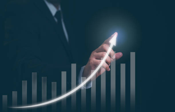 istock Businessman pointing arrow graph and chart, corporate growth plan development to success and growing growth concept. 1882224786