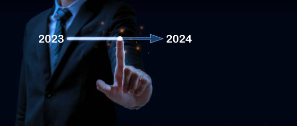 istock Goal. businessman hand touching on loading progress from 2023 to 2024 on dark background, goal target, change from 2023 to 2024, strategy, investment, business planning, happy new year concept 1882263289
