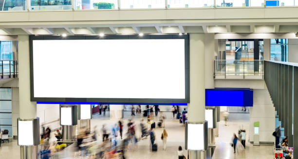 istock Blurred people and blank billboard in airport 1882314405