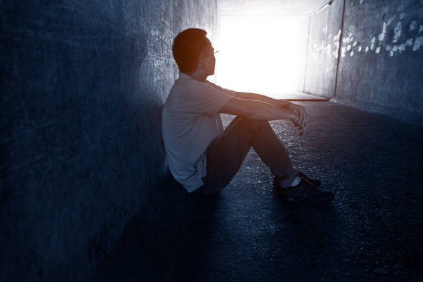 istock Desperate man sitting in the tunnel 1882314948