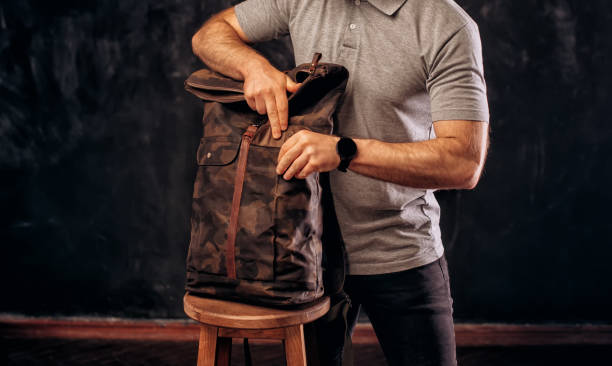 istock Man hold Canvas Backpack accessories. Hand made backpack for travelers. 1882319202