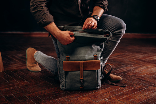 hipster man with stylish shoulder bag. lifestyle, fashion, style and people concept