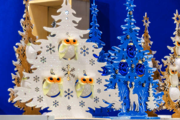 White plywood decorative Christmas tree with owls