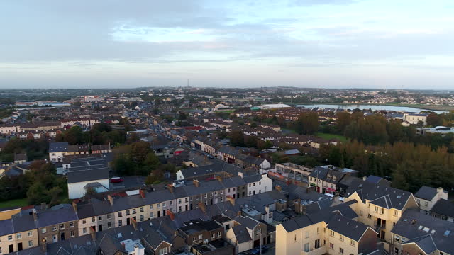 Slow panning drone shot during sunset over Galway, Ireland.