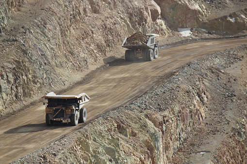 Cripple Creek, United States – August 15, 2014: The Dump Trucks hauling mining material at Cripple Creek Victor Gold Mine in Colorado
