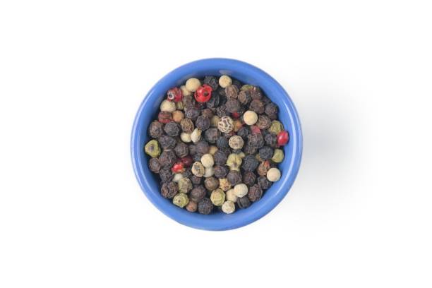 istock Mixed papper on blue bowl on white background. Seen directly above. 1882415389