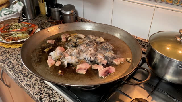 Making seafood paella at home