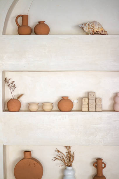 istock Array of various clay pots and other artifacts placed on Mediterranean-style shelves 1882462051