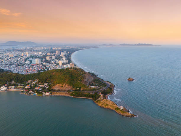 istock Panoramic coastal Vung Tau view from above, with waves, coastline, streets, coconut trees, Mount Nho in Vietnam behind the statue of Christ the King 1882495903