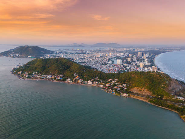 istock Panoramic coastal Vung Tau view from above, with waves, coastline, streets, coconut trees, Mount Nho in Vietnam behind the statue of Christ the King 1882495918