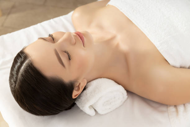 istock Relaxed young woman on massage, light background 1882509441