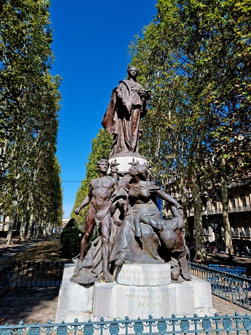Bronze statue of the French Republic on a pedestal. At the foot of the pedestal a bronze sculpture group, showing Toulouse. Sculpor was Théophile Barrau (Villepinte 1848 - Paris 1913). the image was captured during autumns season.