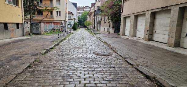 istock A narrow street with cobblestones 1882587859
