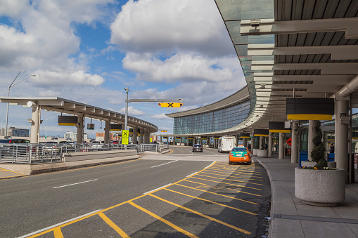 Mississauga, ON, Canada - May 7,  2017: Taxi at pickup area of Toronto Pearson Airport. Pearson is the largest and busiest airport in Canada