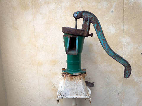 Old fashioned hand pump used for pumping water