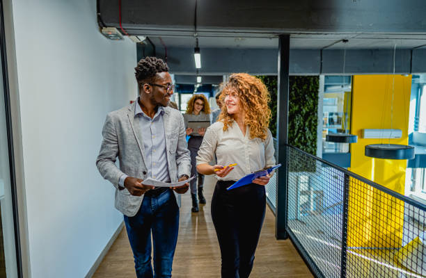 istock Colleagues talking on the way to the office 1882647349