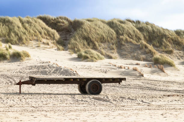 istock Abandoned trailer on the beach in Texel. 1882707377
