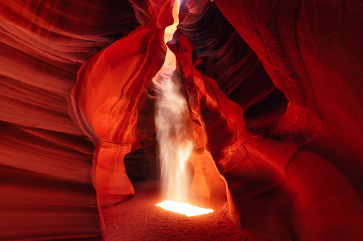 A light penetrates the cave in Antelope Canyon in Arizona at midday