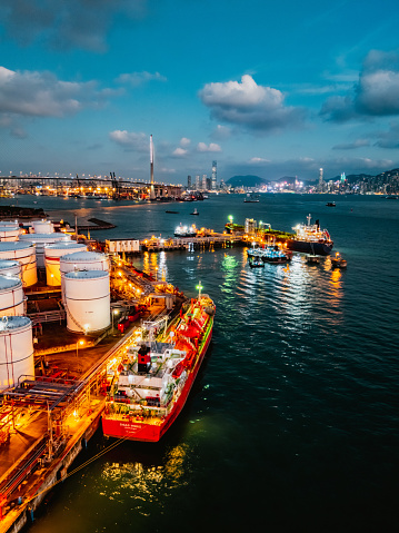 defaultTank ship loading unloading oil and gasoline at Commercial dock in sea