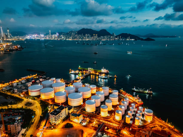 istock Tank ship loading unloading oil and gasoline at Commercial dock in sea 1882788043