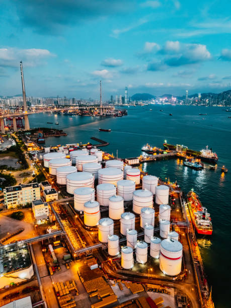 istock Tank ship loading unloading oil and gasoline at Commercial dock in sea 1882788050