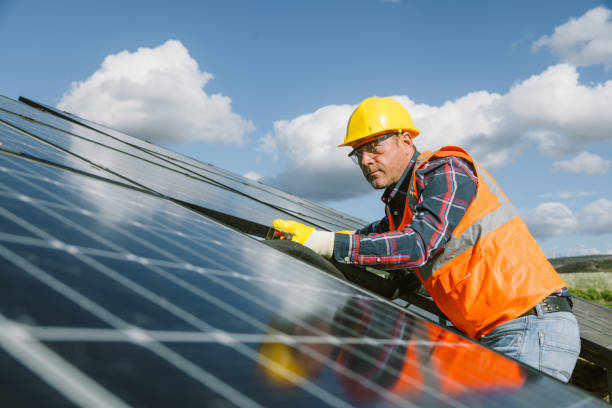 istock Solar Farm Inspection: Engineers Checking Operation for Clean Energy Production 1882799836
