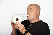 Quirky Madness: Middle-aged Caucasian Man with Toilet Paper Roll - White Background