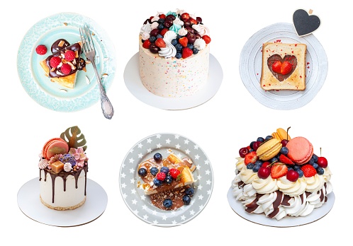 Set of isolated homemade desserts and cakes with fresh berries. Toast, pavlova, slice of cheesecake and cakes on colorful plates. Ideas for menu