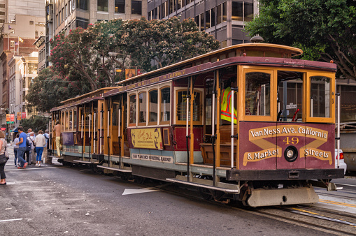 San Francisco , USA - October 11,2015: Passengers ride in a cable car, the most popular attraction of San Fransisco.