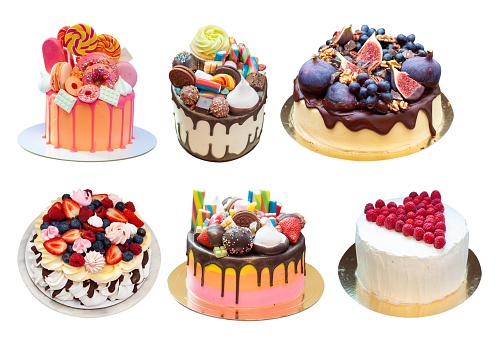 Set of beautiful bright multicolored cakes with sweets, chocolate fruits and berries isolated on plain white background png.