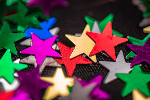 Texture multicolored shiny stars for holiday background
