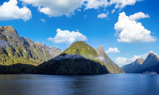 Panoramic view of scenic landscape of Milford Sound fjords in New Zealand.