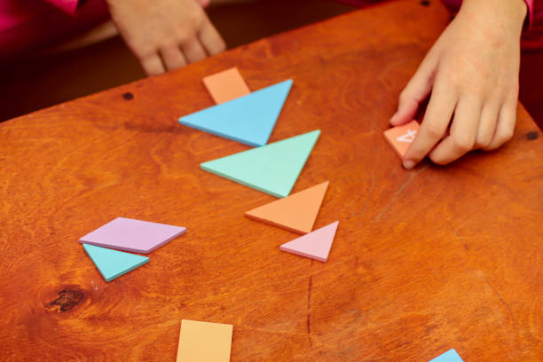 istock wooden multi-colored elements of logic puzzles during the game on the table 1882874539