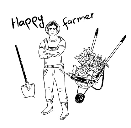 A young farmer stands with a shovel and a cart with vegetables.Agriculture concept.Farming