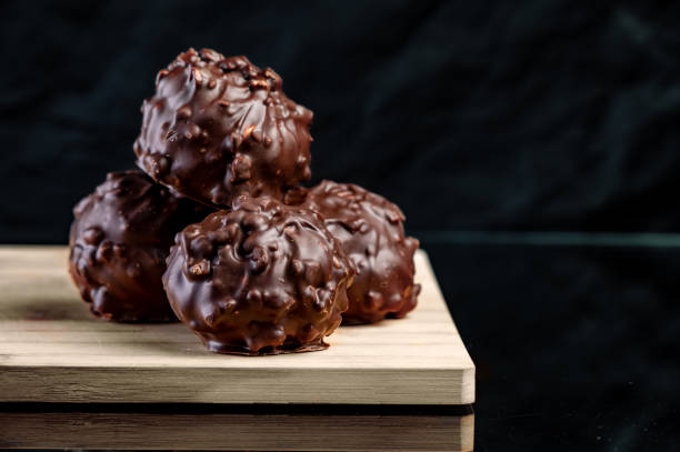 istock Chocolate pralines. Delicious Chocolate and Nuts Balls.  Copy space 1882938236